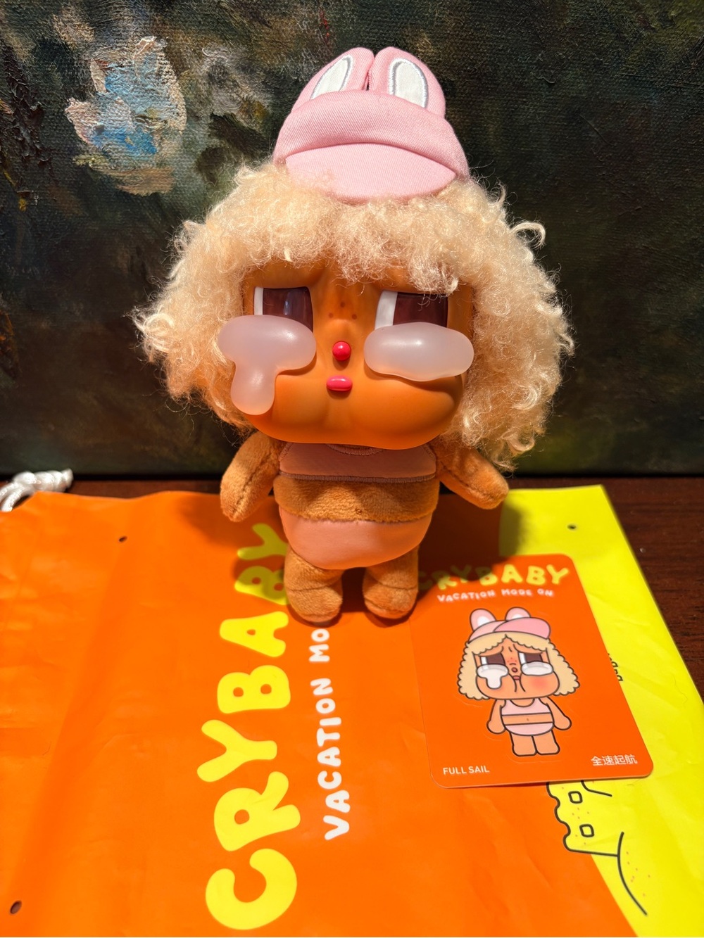 Crybaby Plush Doll with Pink Cap and Curly Hair